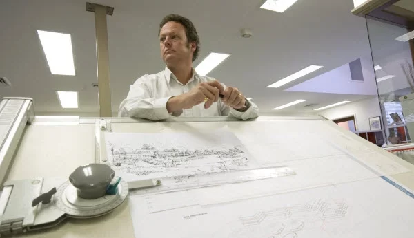 Man standing in front of a sketch