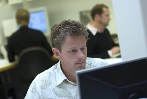 Man busy looking at the desktop monitor