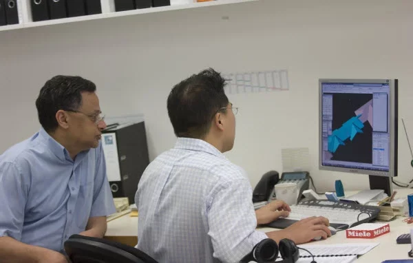 Two designers busy designing using 3D modelling