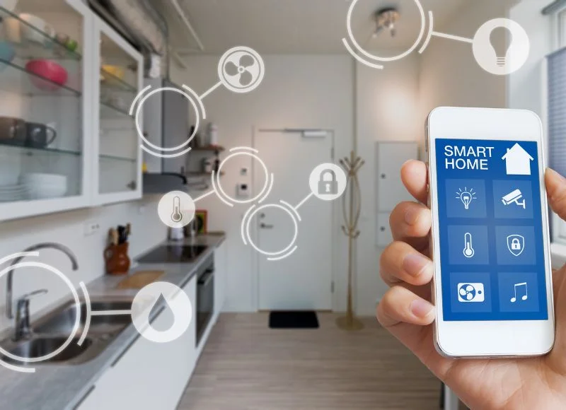 Smart home technology interface on smartphone app screen with augmented reality (AR) view of internet of things (IOT) connected objects in the apartment interior, person holding device