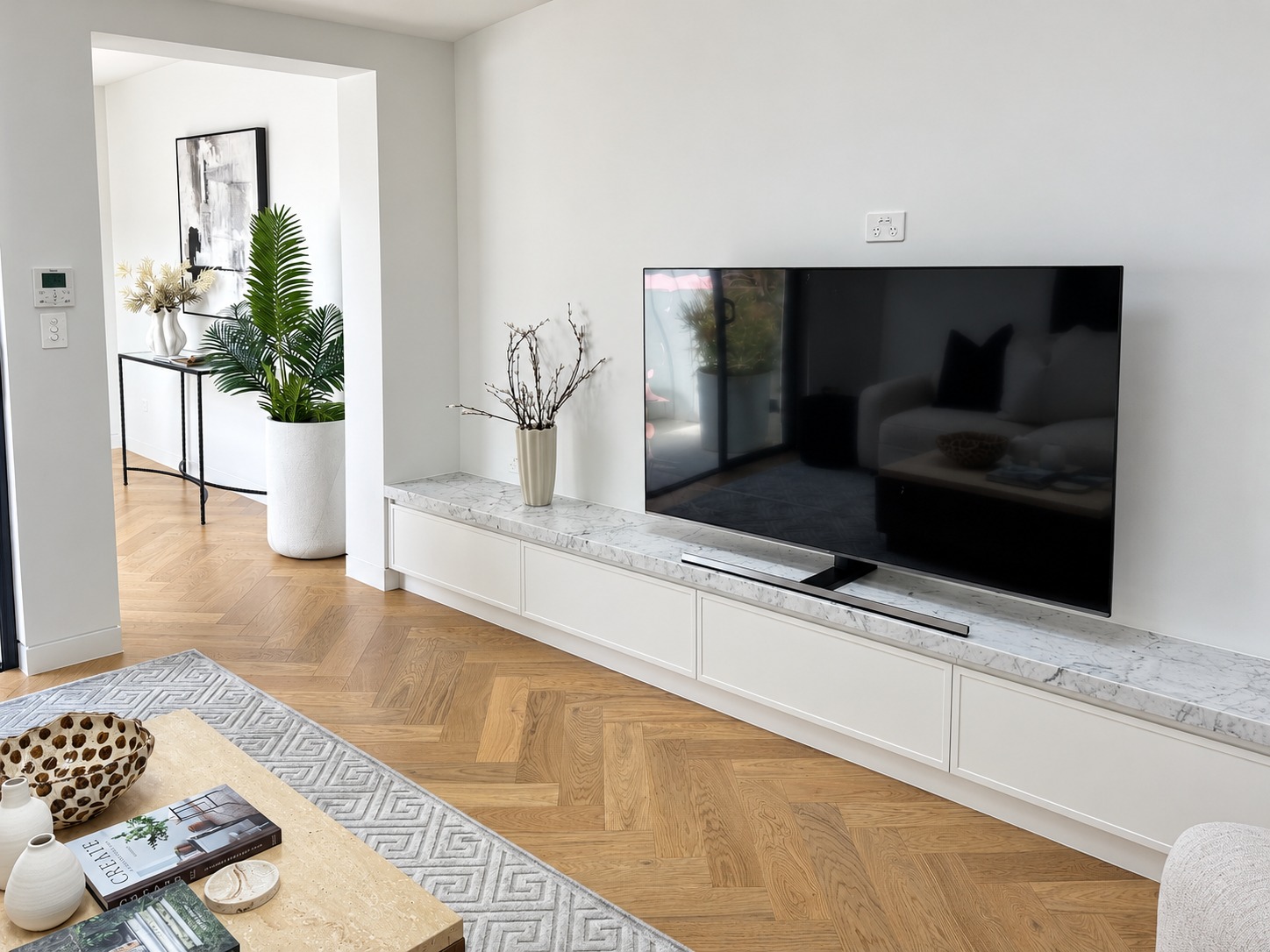 Living area with herringbone timber floor in a Paddington terrace house renovation